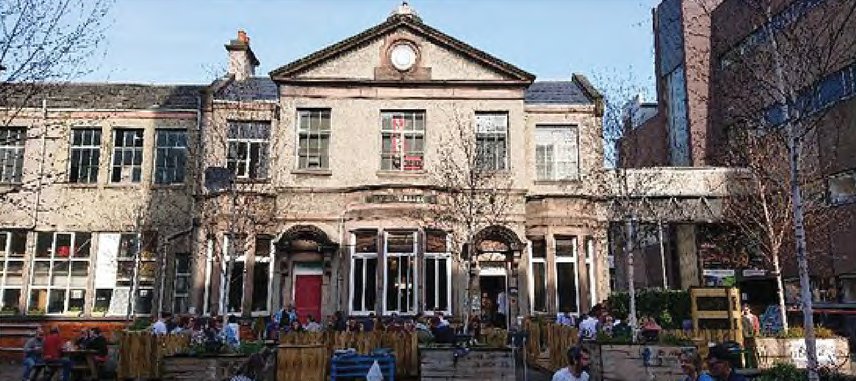 The Royal Dick building with outdoor seating in the courtyard today